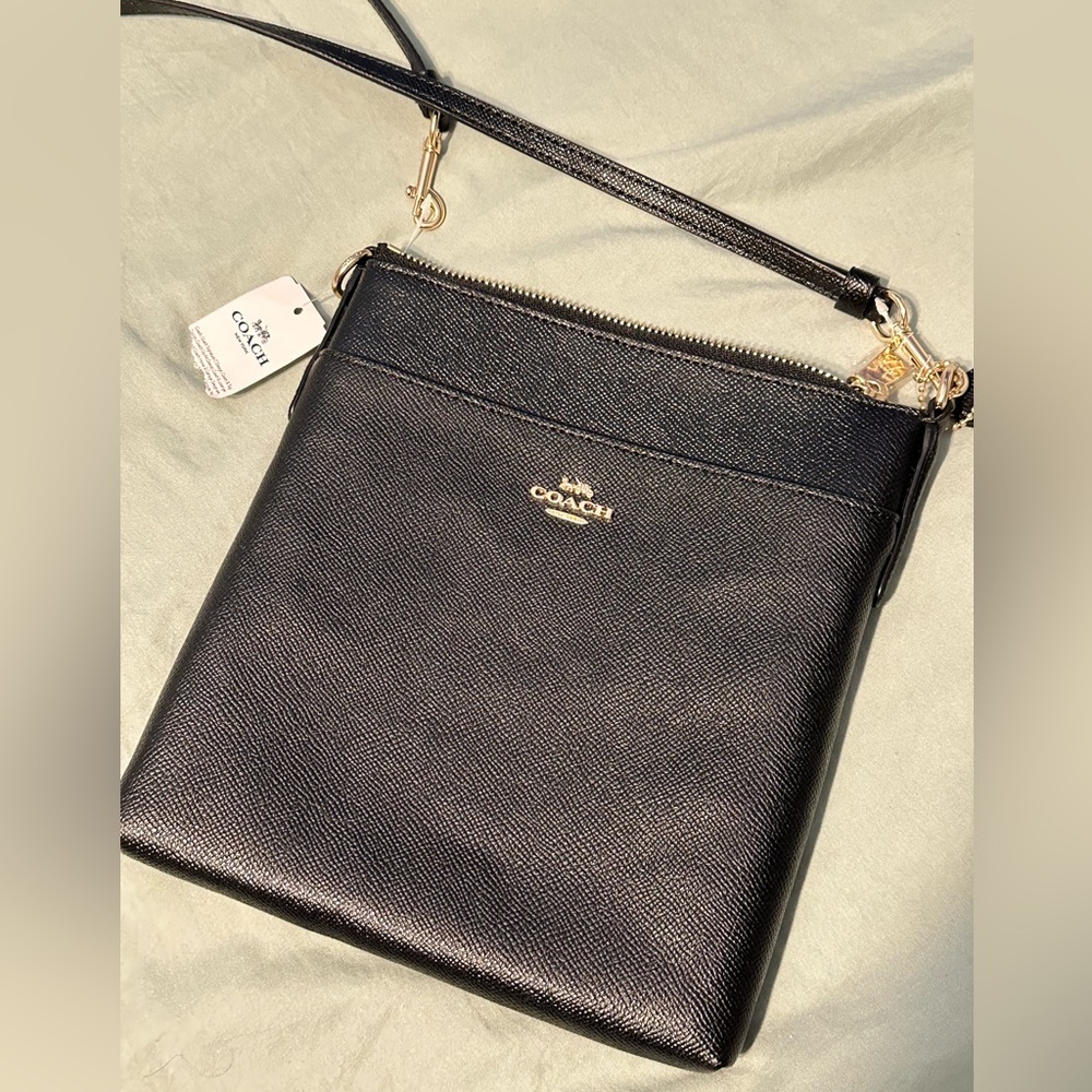 Black leather Coach saddle bag